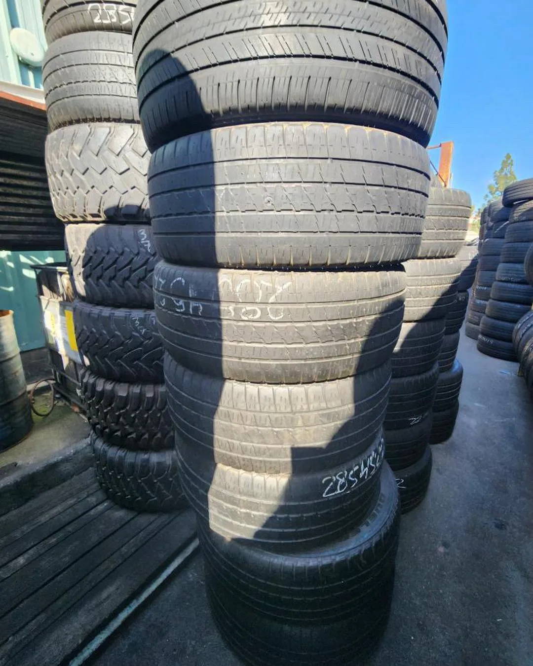 Tower of wholesale used tires at Direct Tire Zone